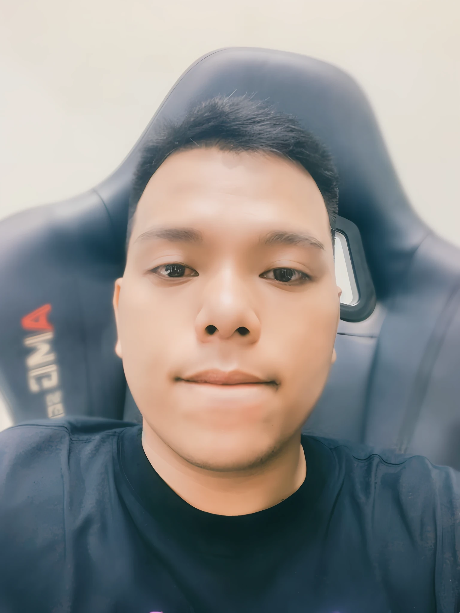 there is a man sitting in a chair with a cell phone in his hand, 2 7 years old, portrait of jerma985, john jude palencar, twitch streamer / gamer ludwig, ramil sunga, 2 8 years old, thawan duchanee, david luong, 2 3 years old, 8k selfie photograph