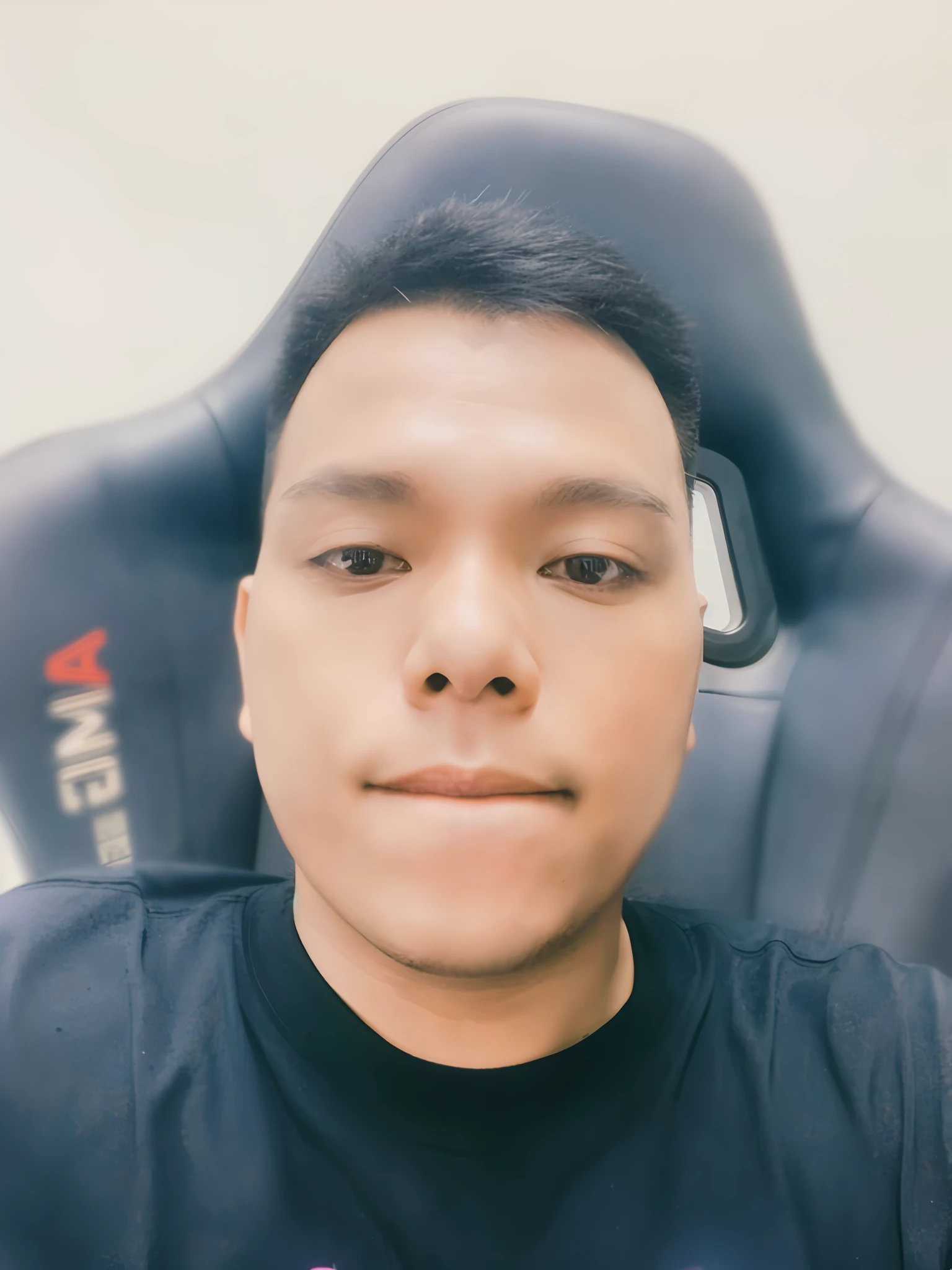 there is a man sitting in a chair with a cell phone in his hand, 2 7 years old, portrait of jerma985, john jude palencar, twitch streamer / gamer ludwig, ramil sunga, 2 8 years old, thawan duchanee, david luong, 2 3 years old, 8k selfie photograph
