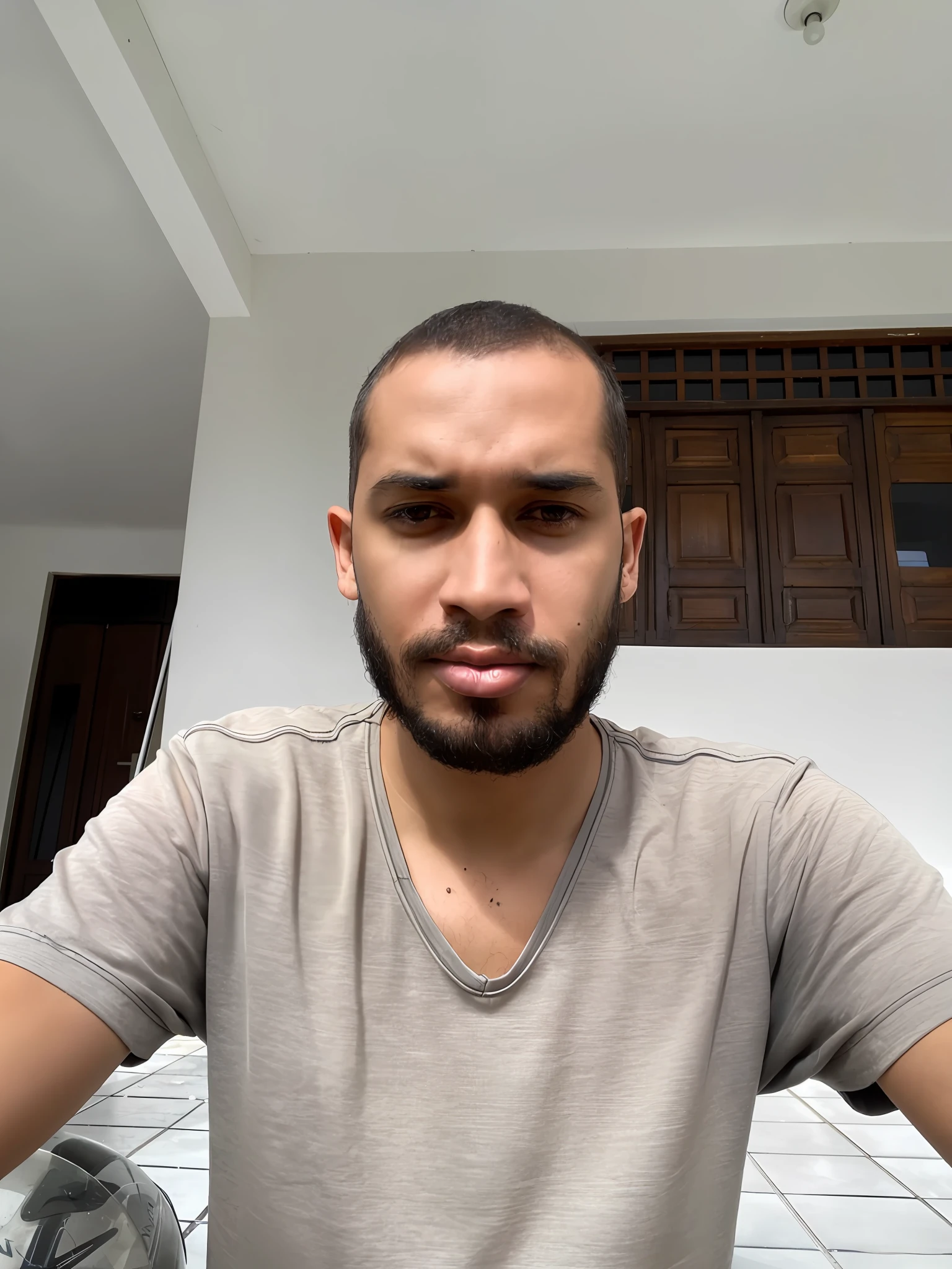 there is a man sitting at a table with a plate of food, 8k selfie photograph, without beard, with no beard, with a small beard, without beard and mustache, mohamed chahin, with serious face expression, wide - angle portrait, staring directly at camera, wideangle portrait, portrait shot 8 k, front facing the camera