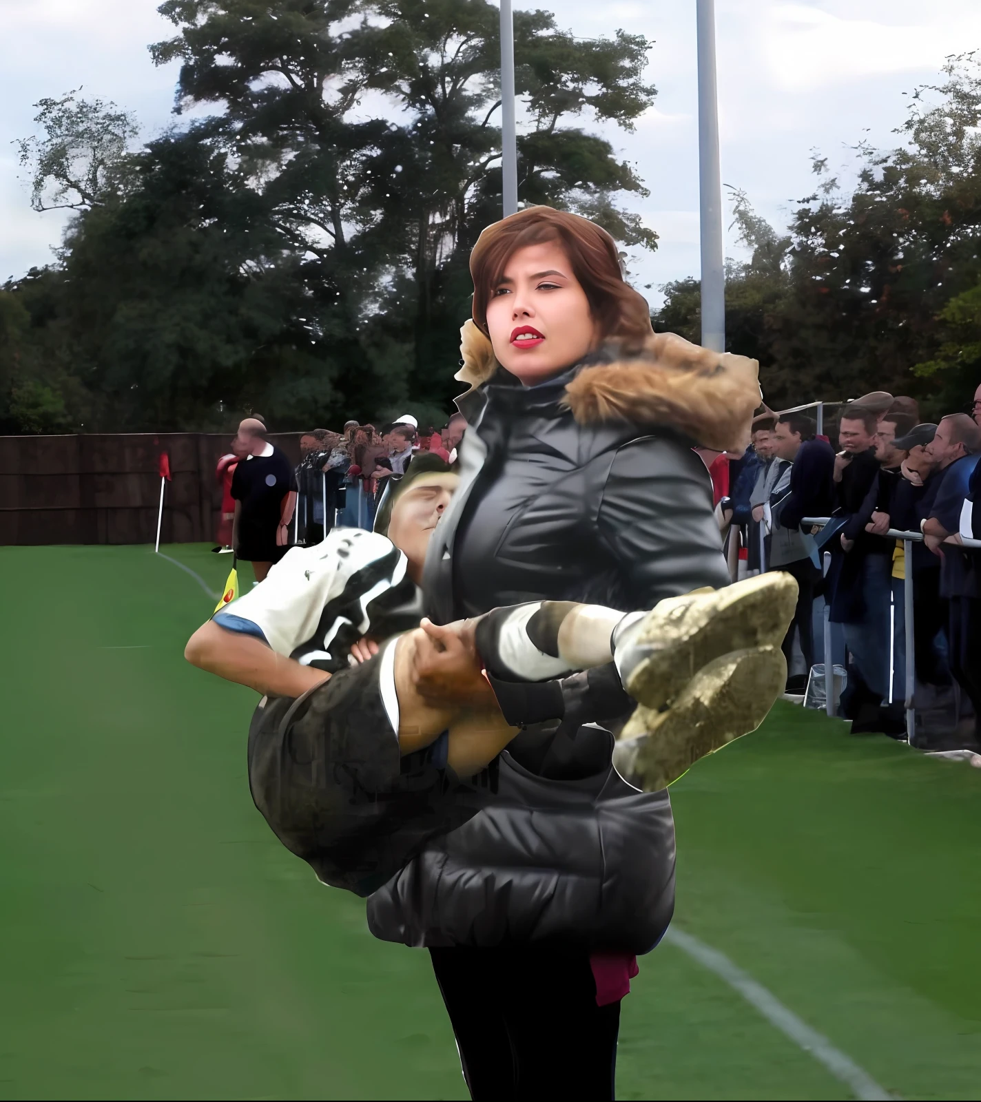 soccer action pose, affection pose, lecherous action pose, dramatic action pose, theatralic pose, there is an attractive woman that is carrying a skinny man, there is a beautiful woman in a shiny coat who is carrying a blond man in her arms, a longhaired beautiful woman in a high-shine black puffy coat, a longhaired woman in a shiny downcoat, a woman is carrying a shorthaired man who is wearing matte cotton shorts and a matte cotton t-shirt, a weak man in matte cotton sports shorts is consciousless and needs to be carried, a shorthaired man with closed eyes is carried in the arms of a longhaired woman, a woman looks very scared and terrified, a consciousless man with closed eyes is suffering very much and has a very painful face, photo, photo shoot, photographed , accident, help, aid, first aid, pity