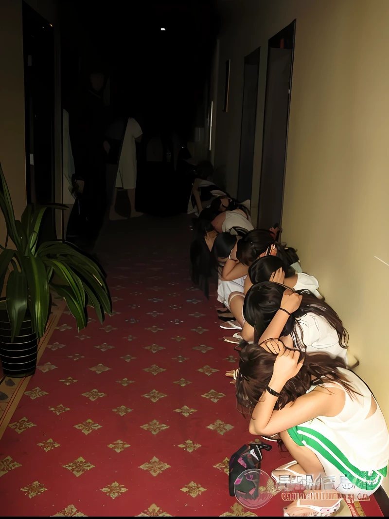 Several people sat on the floor of the hallway with their heads bowed, There are long queues of suspects, desperate pose, in line, in a hotel hallway, they are all laying down, 3 am, 3am, wide - shot, wide wide shot, they are crouching, dead bodies in the background, They may be crawling, Head down, leaked photo