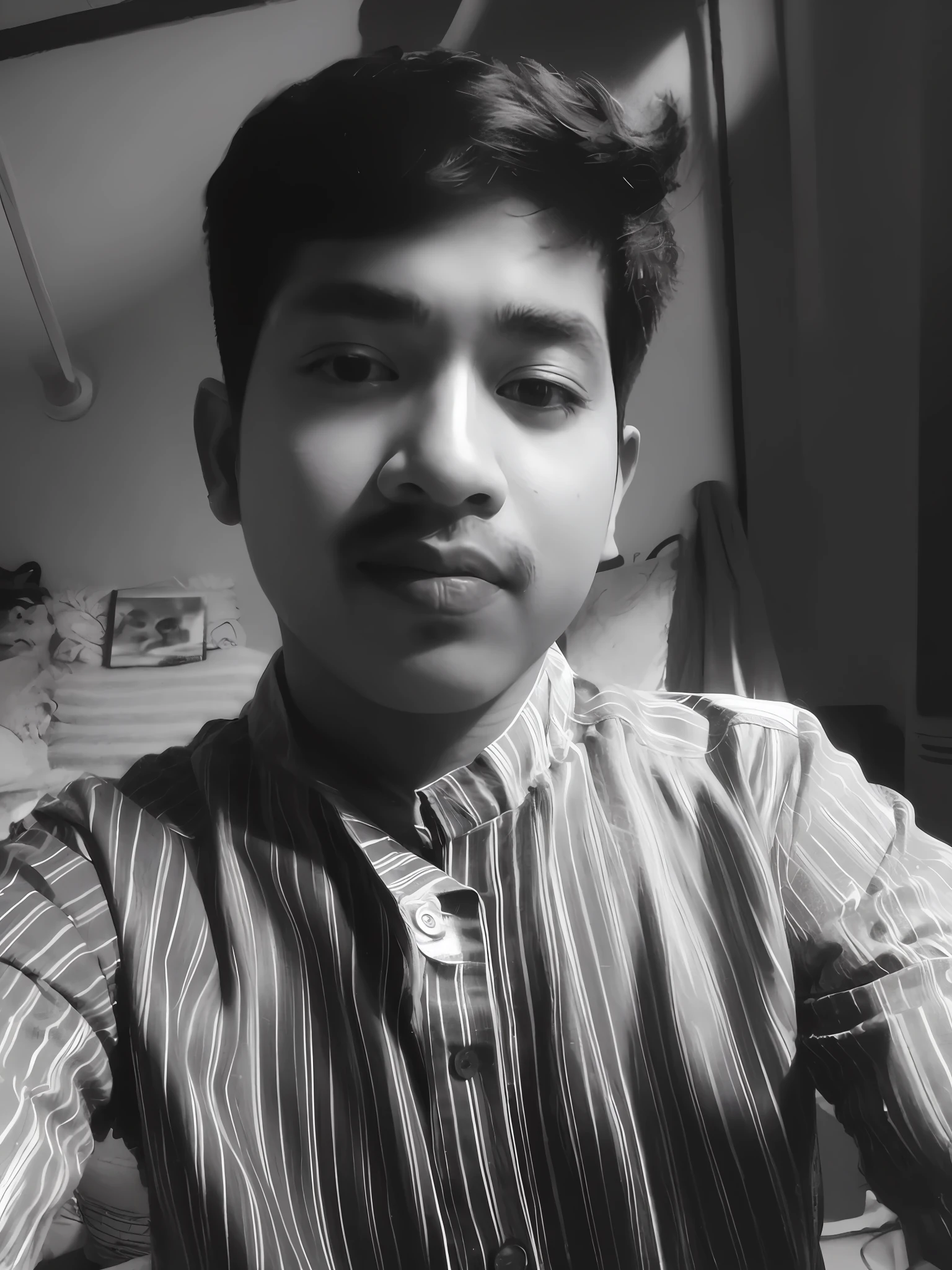arafed boy with a tie and shirt on sitting in a room, inspired by Bikash Bhattacharjee, with accurate face, with kind face, black and white picture, around 1 9 years old, selfie photo, candid picture, candid photo, taken with the best dlsr camera, old picture, in black and white, desaturated!!