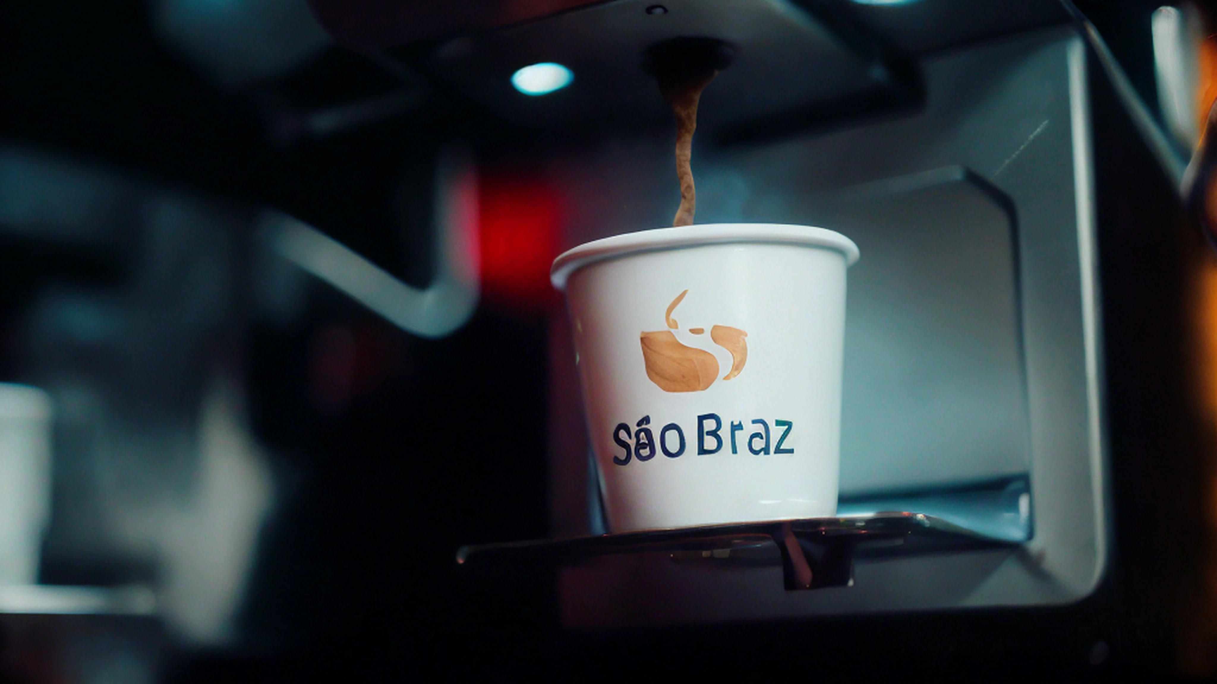 Cup of coffee being poured into a coffee machine, by João Artur da Silva, sao paulo, São Paulo, brasileiro, Braavos, Directed by: Elsa Bleda, In Sao Paulo, Brasil, coffee cup, Braseiros, by Antonio Parreiras, lucas graziano, Liam Brazier, Marz, copo de papel, description