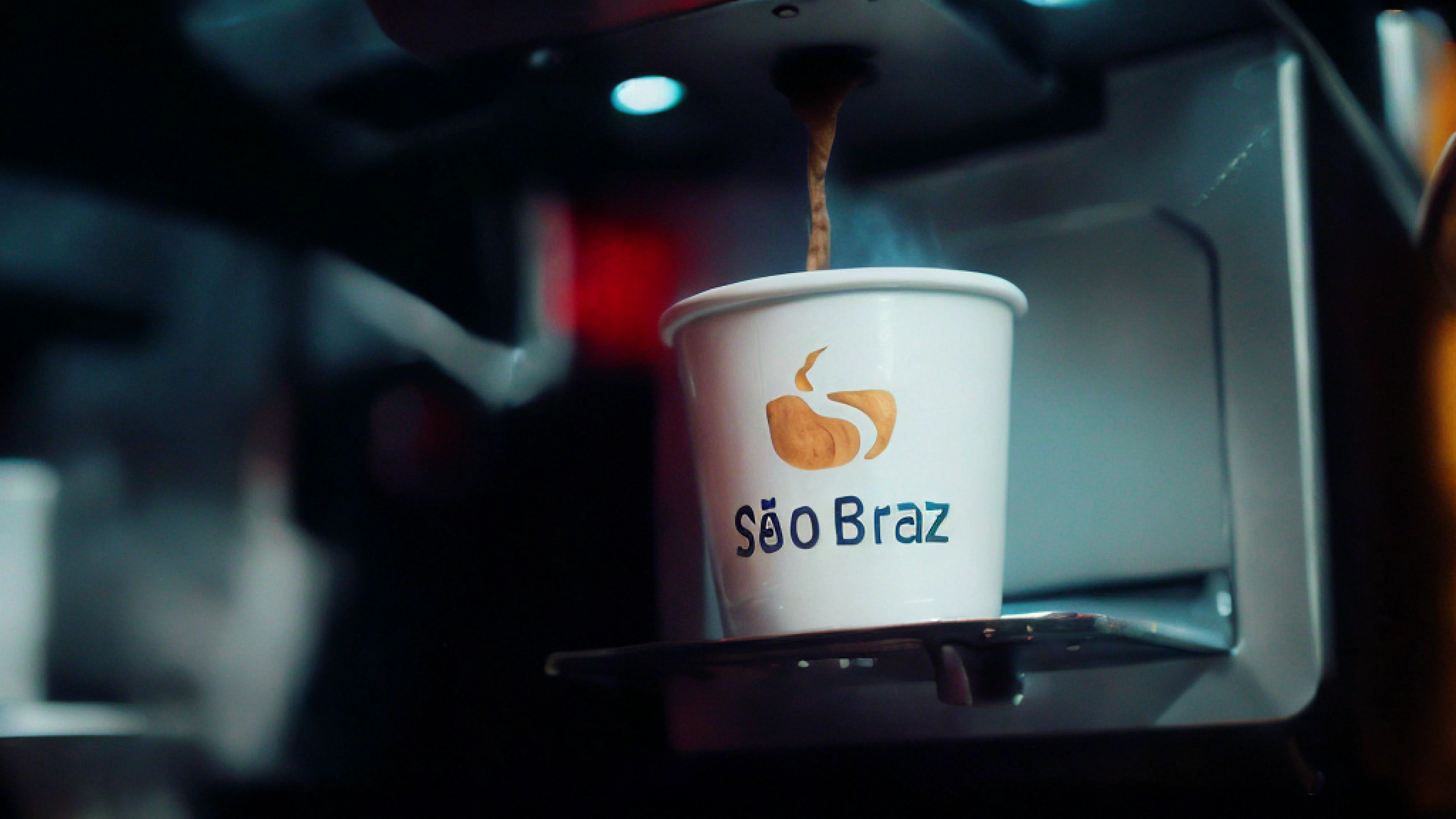 Cup of coffee being poured into a coffee machine, by João Artur da Silva, sao paulo, São Paulo, brasileiro, Braavos, Directed by: Elsa Bleda, In Sao Paulo, Brasil, coffee cup, Braseiros, by Antonio Parreiras, lucas graziano, Liam Brazier, Marz, copo de papel, description