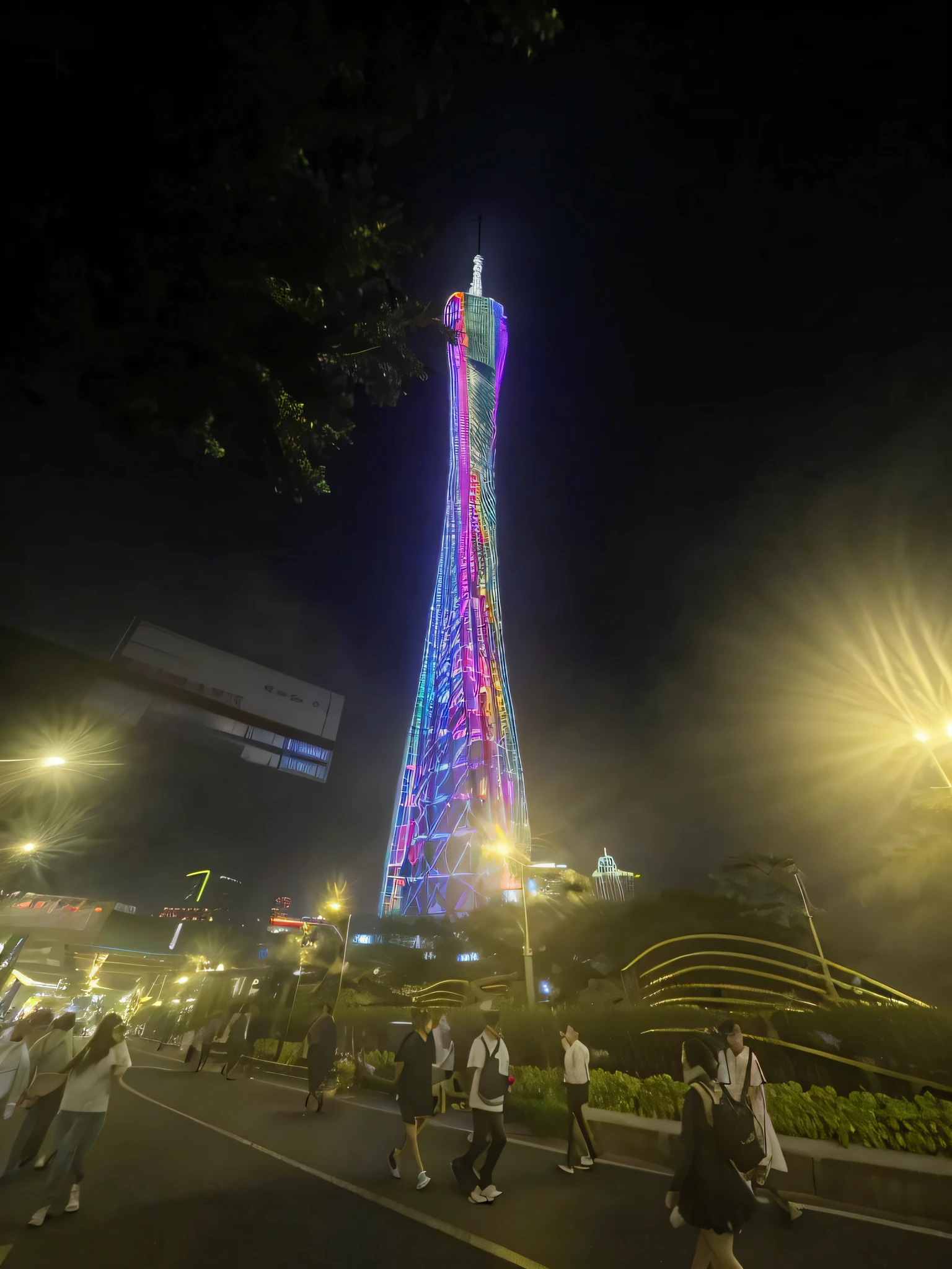 People stroll through the city at night，In the background is a tall tower(k hd), 1km tall, a 15 foot tall, that is 1300 feet tall, twisted giant tower, night shot(k hd), with glowing lights at night, shenzhen, stunning sight, Green lights at night, view from bottom to top, A colorful, led lights around the place(k hd), 5 d