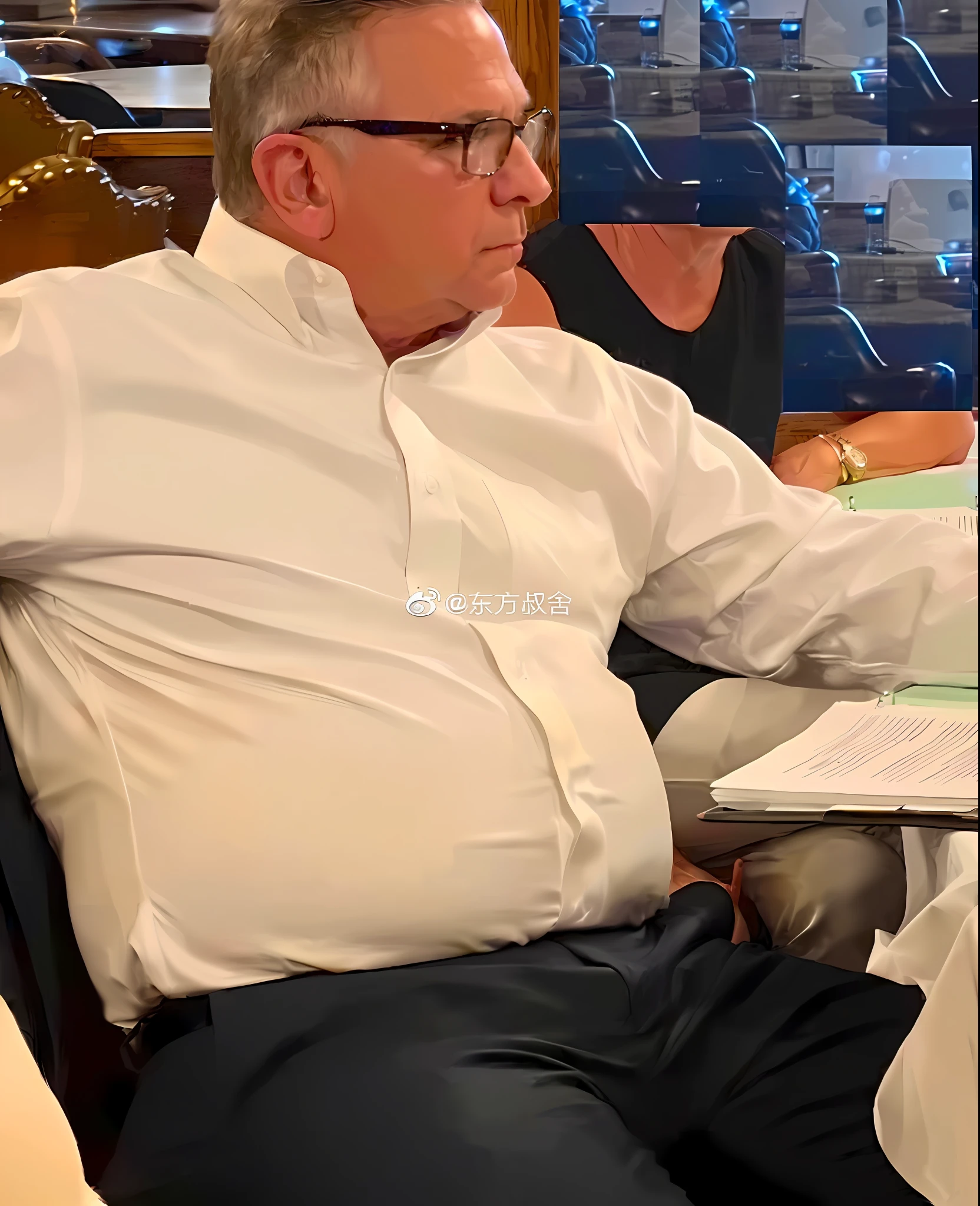 There was a man sitting at the table，With a glass of wine, looking to his left, photo from 2022, taken in the early 2020s, watermarked, candid shot, looking to his side, lawther sit at table playing dnd, author：Robert S, shoulder in front pose, taken in 2 0 2 0