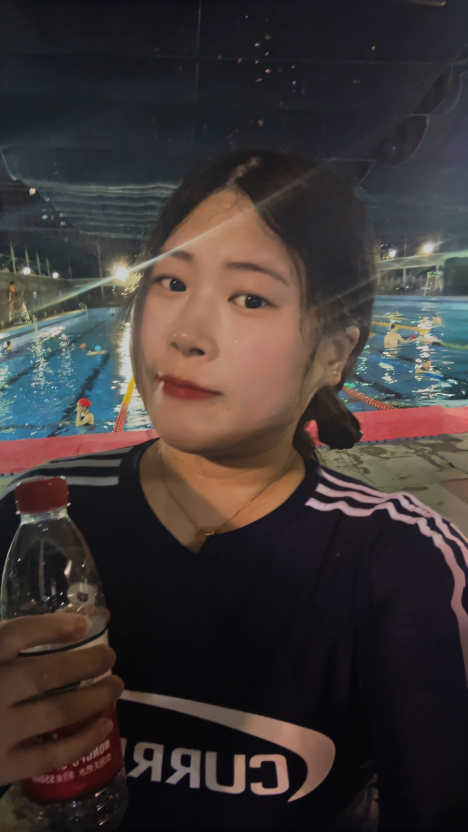 there is a woman holding a bottle of water in front of a swimming pool, wenfei ye, 2 7 years old, profile pic, xintong chen, taejune kim, 2 8 years old, Swimming, 3 2 - year - old, 2 9 years old, photograph taken in 2 0 2 0, jiyun chae, in a swimming pool, next to a pool