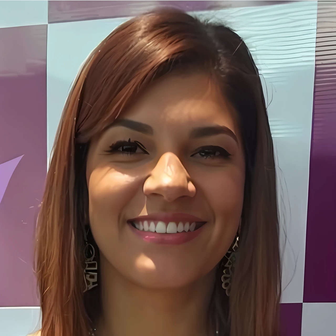 Smiling woman with long brown hair and earrings standing in front of a purple and white wall, fernanda suarez, Alanis Guillen, Lorena Avarez, Valentina Embaralhamento, Magda Torres Gurza, Estefania Villegas Burgos, Carola Rubio, julia fuentes, Caroline Gariba, Directed by: Nandor Soldier