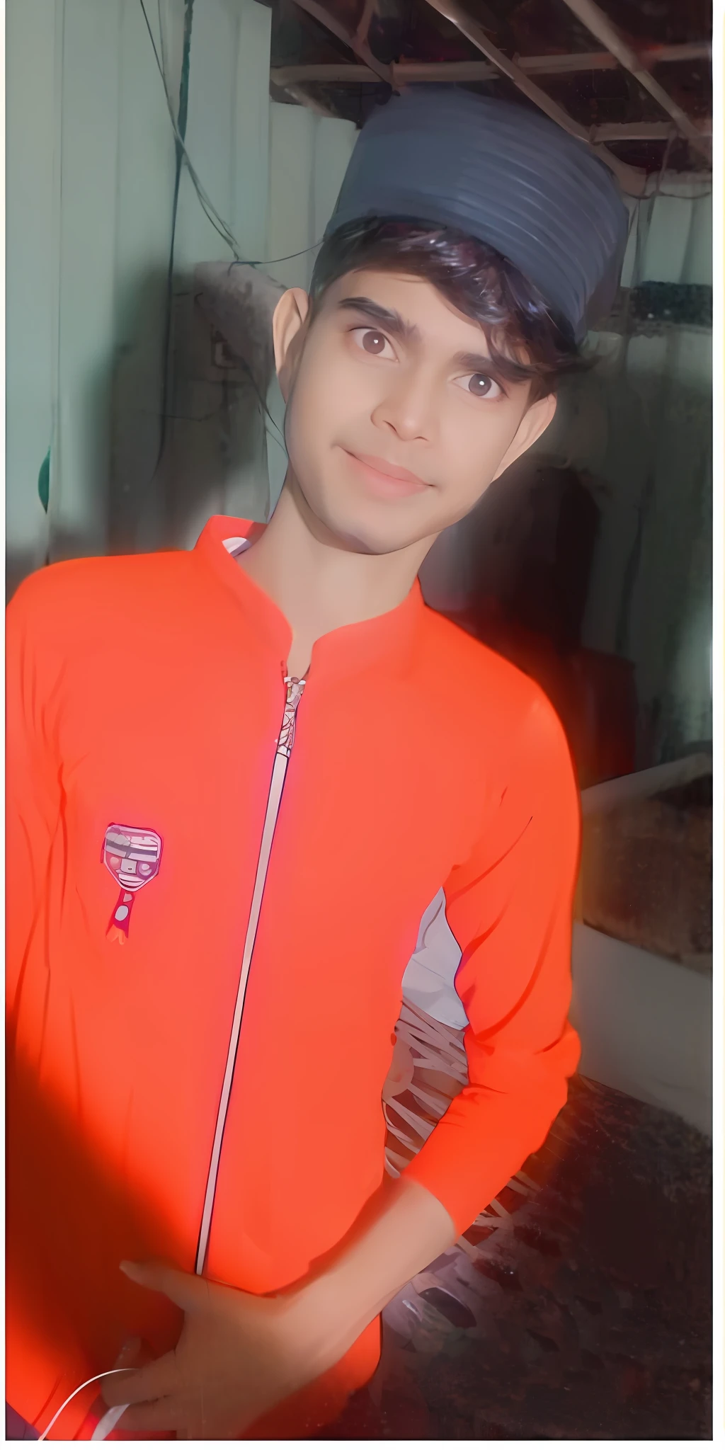 there is a young man wearing a baseball cap and a red jacket, very very low quality picture, with a beautifull smile, riyahd cassiem, with accurate face, reyyan, with lovely look, profile pic, old picture, profile picture 1024px, portait photo profile picture, friedly smile, candid picture, ayan nag