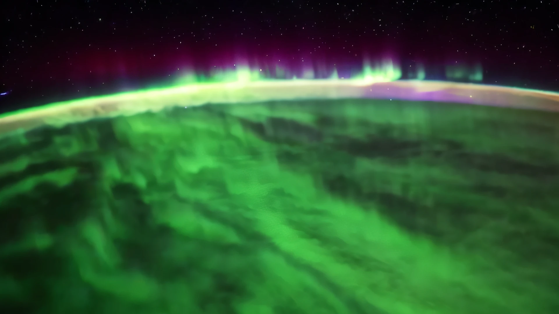 a view of the aurora bore from space with a green and purple light, northern lights in space, nasa footage, strong aurora overhead, distant nebula are glowing algae, image credit nasa nat geo, 3d, shot from space, footage from space camera, as seen from space, looming over earth in space, view from space, space atmosphere, seen from space
