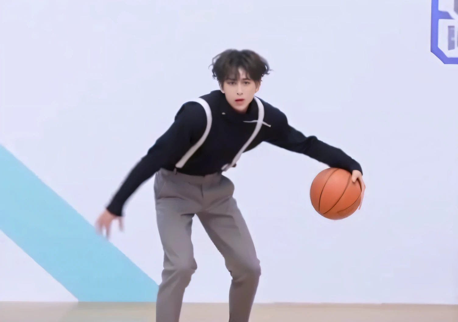 there is a man that is playing with a basketball ball, he is dancing, cai xukun, perfect dynamic pose, trending dribble, from then on a basketball, playing basketball, he is floundering, dribbling, look like someone is dancing, dribble, in an action pose, holding a ball, low quality video, dribble popular