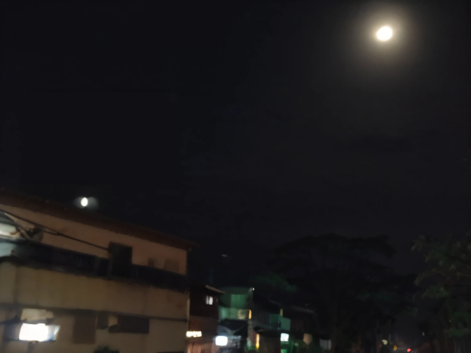 nighttime time picture of a street with a full moon in the sky, at night with full moon, at night with moon light, nigth moon ligth, with full moon in the sky, moon in background!, fullmoon, big moon on the right, (moon in the background), the moon is big an in the city, in front of a pale full moon