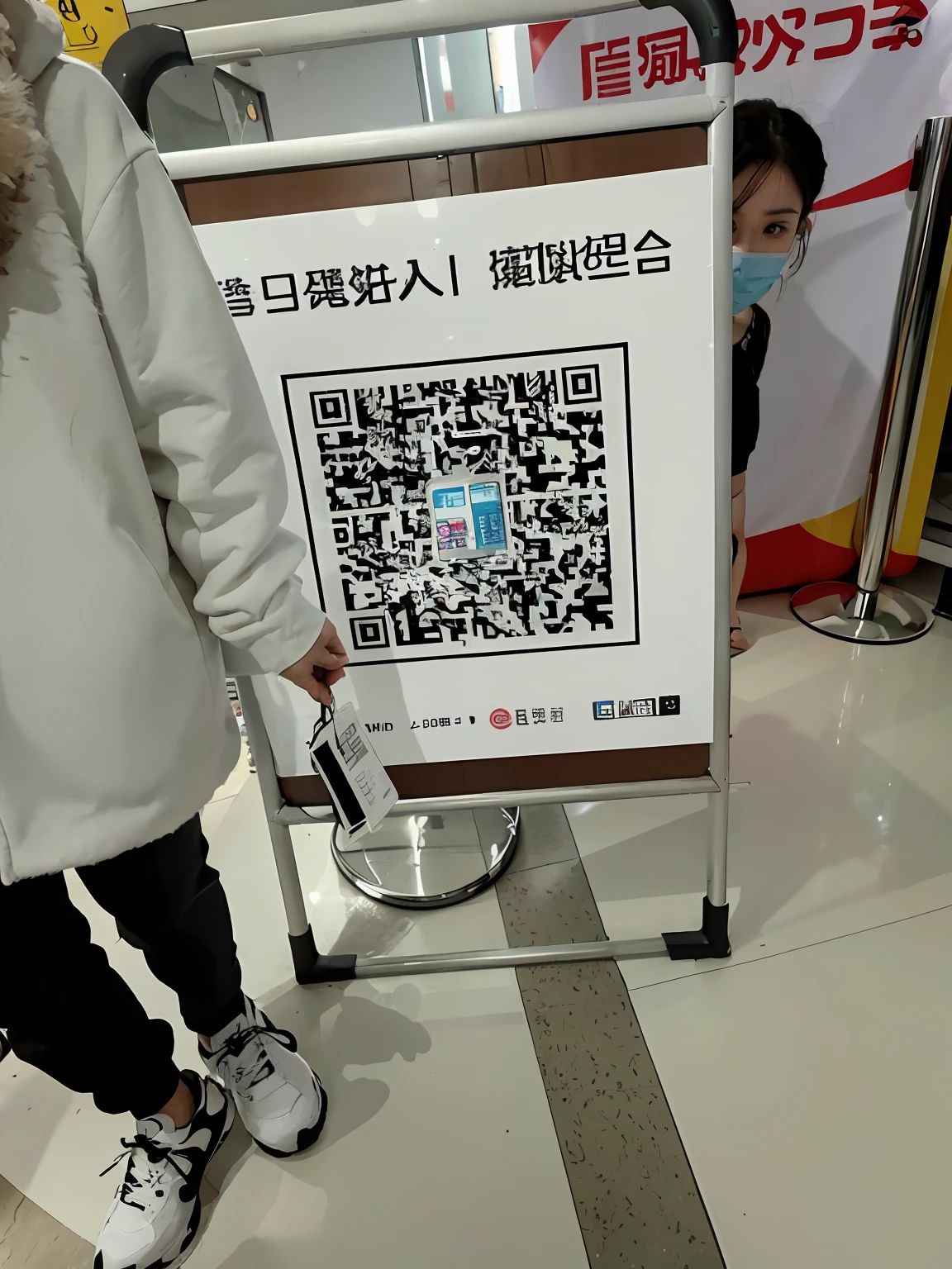 An image of a person standing next to a sign with a QR code, smartphone displays qr code, 🔞🤡, a poster, the photo shows a large, in a mall, appearing in a shopping mall, scan, trending at cgstation, a person standing in front of a, from china, very coherent image