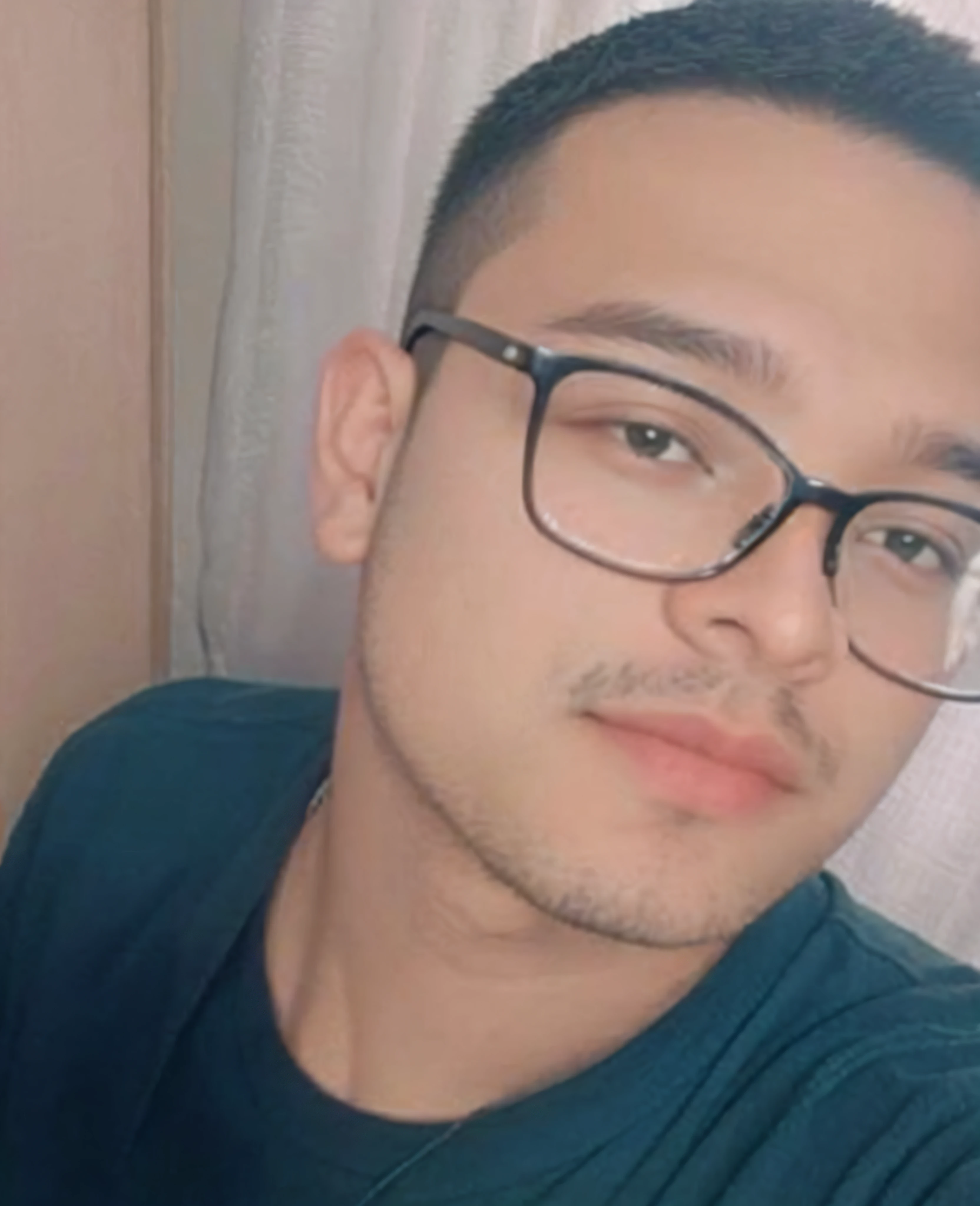 there is a man with glasses and a green shirt taking a selfie, taken in the early 2020s, around 1 , 18 years old, very very low quality picture, andres rios, headshot profile picture, he is about 2 0 years old, he is about 20 years old, 1 6 years oldic