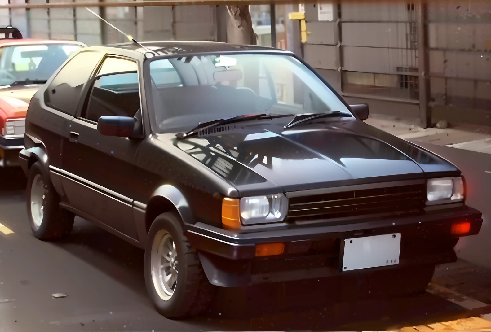 A black car is parked on the side of the road, AE 8 6, 1 9 8 5, 1985, 1984, 1 9 8 4, 1 9 8 3, 1983, 1 9 9 0, 1990, 1986, 1 9 8 6, 1982