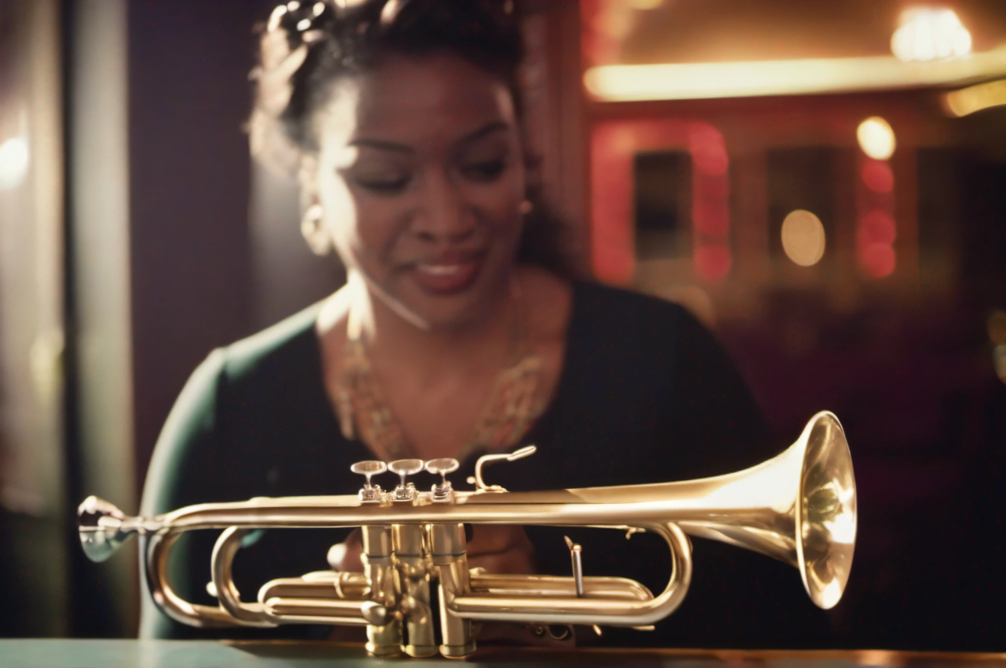 Woman playing trumpet in jazz club in New York