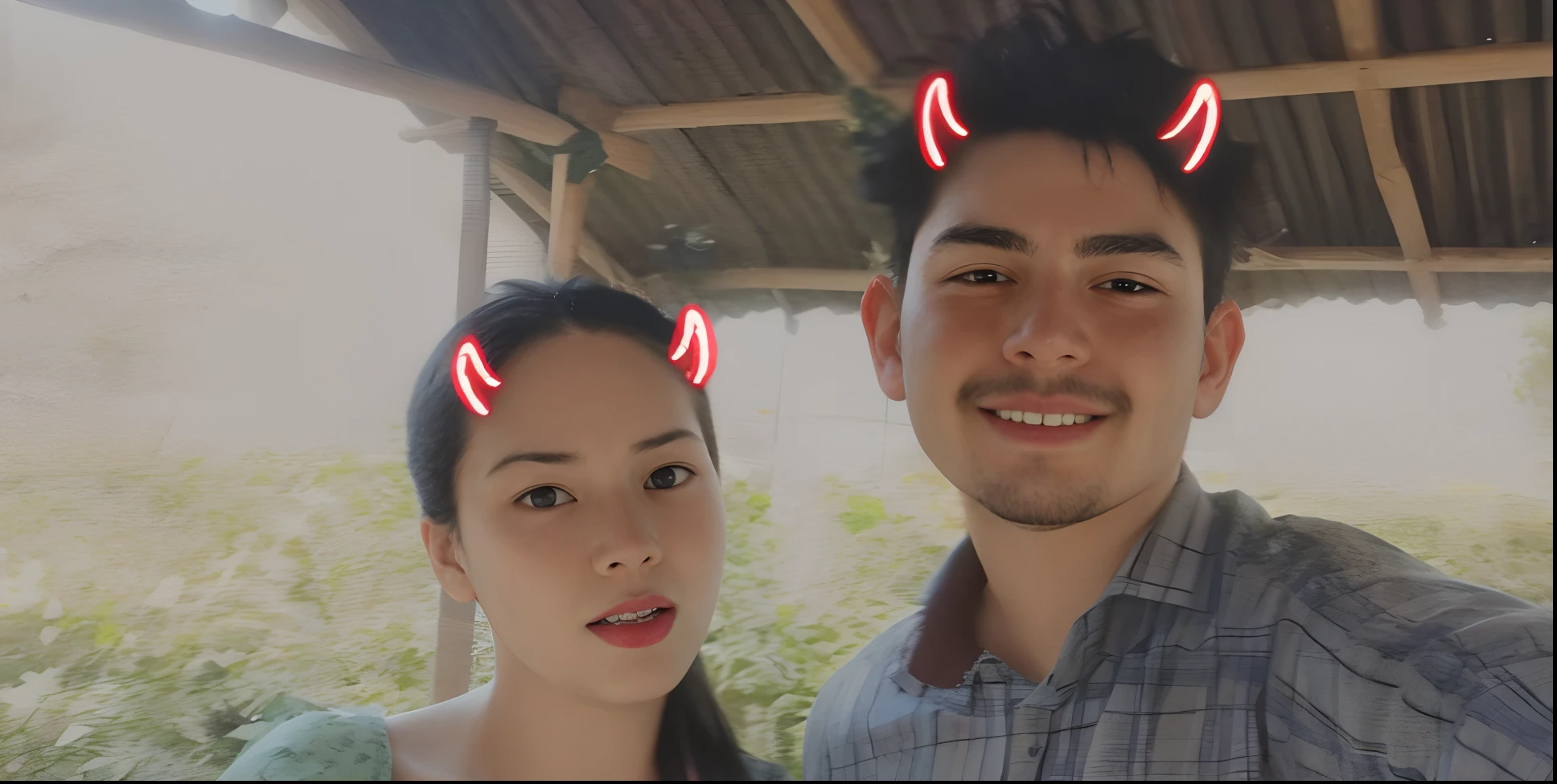 there are two people standing next to each other with red devil horns on their heads, distorted photo, very very low quality picture, low quality photograph, scratches on photo, very accurate photo, with instagram filters, long distance photo, 😭🤮 💔, profile image, low quality photo, low quality instant camera photo, couple, profile pic, grainy low quality