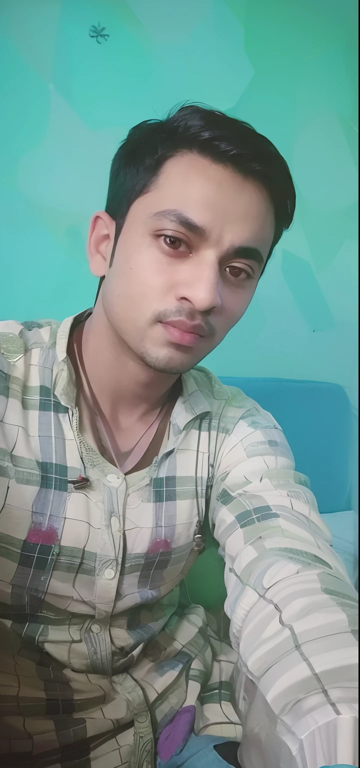 arafed man sitting on a couch with a green wall in the background, with accurate face, ayan nag, with lovely look, very clear picture, without helmet, vinayak, very very low quality picture, without beard, around 1 9 years old, portait photo profile picture, with kind face, young man, facebook profile picture, candid picture, vastayan