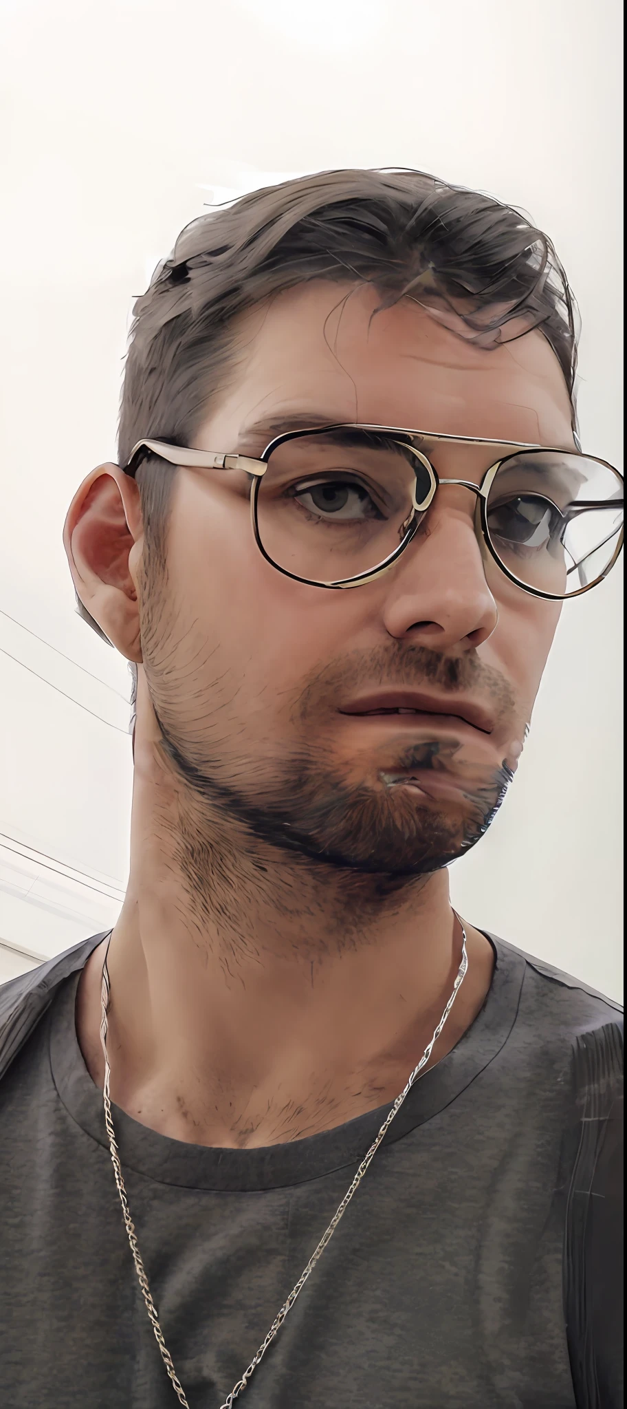 There's a man in a gray suit with aviator-style glasses.