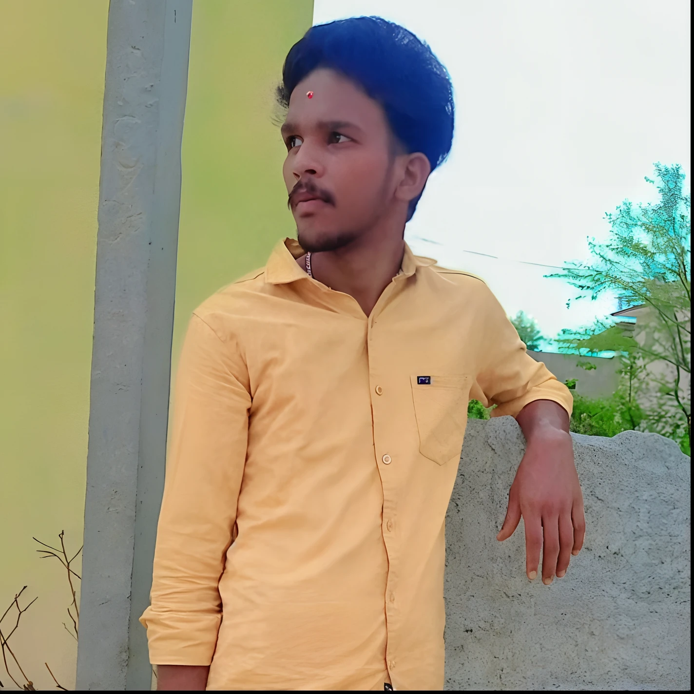 there is a man standing next to a large rock in a yellow shirt, ayan nag, very very low quality picture, stylish pose, with lovely look, candid picture, very clear picture, very artistic pose, around 1 9 years old, with a cool pose, profile pic,  change into neon, 8k, realistic image of the man