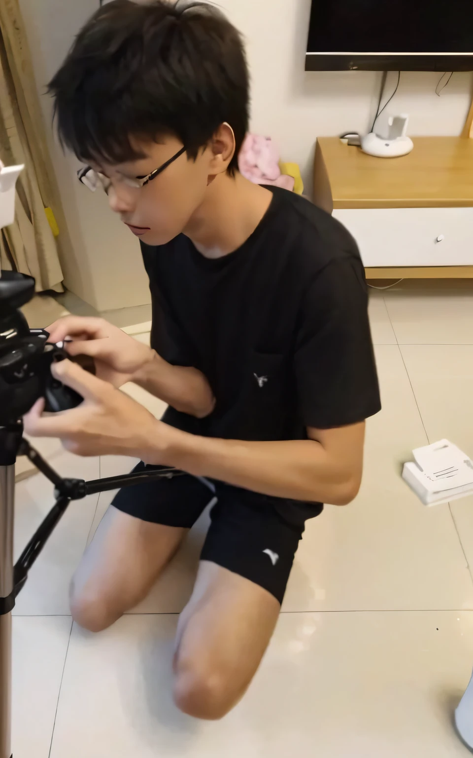 There was a young man sitting on the floor with a camera, low quality footage, low quality video, yanjun cheng, chinese artist, very very low quality picture, with hand crossbow, 8k selfie photograph, tripod, mana shooting from his hands, very poor quality of photography, photoshoot, weird camera angle, Low camera position, inspired by Yanjun Cheng