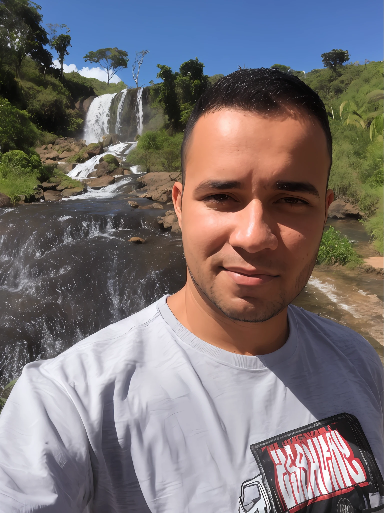 Arafed man standing in front of a waterfall with a shirt, cachoeiras ao fundo, cachoeira ao fundo, ao lado de uma cachoeira, com uma cachoeira, com cachoeiras, standing near a waterfall, em frente a uma cachoeira, with trees and waterfalls, (waterfall), cachoeira no fundo, caio santos, david rios ferreira, Standing in a waterfall