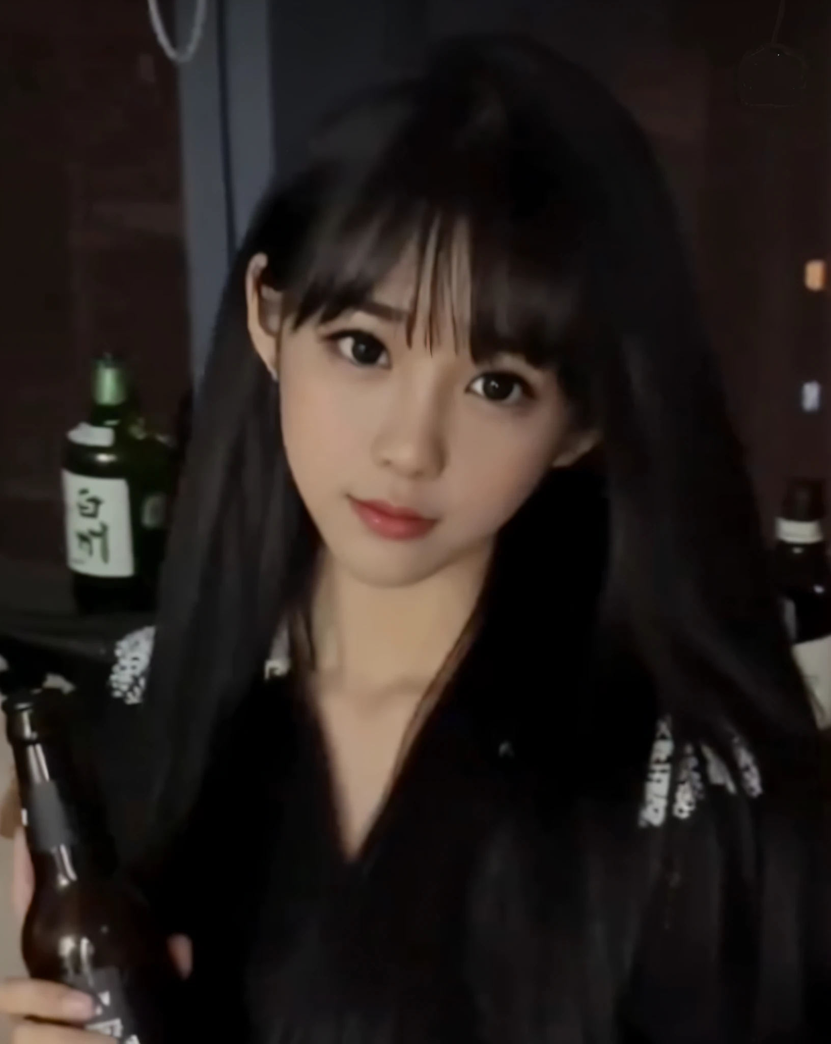 There is a woman holding a beer bottle in her hand, She has black hair with bangs, real life anime girl, Korean Girl, ulzzangs, anime thai girl, Lalisa Manoban in blackpink, jisoo from blackpink, Chinese girl, Larisa Manobal, cruel korean goth girl, young and cute girl, wan adorable korean face