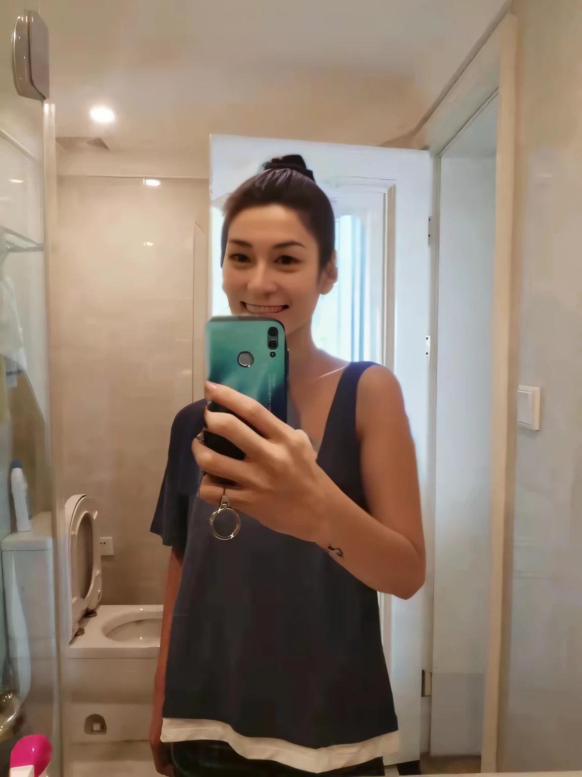 Woman in sexy bikini taking selfie in bathroom,a picture