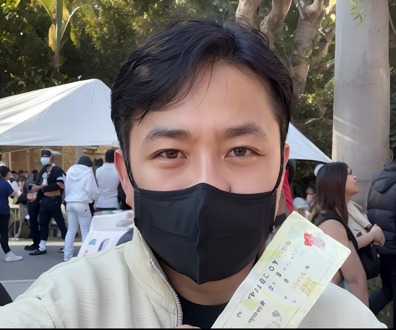 Actor in black mask holding ticket in front of crowd on Twitter, taken in the early 2020s,