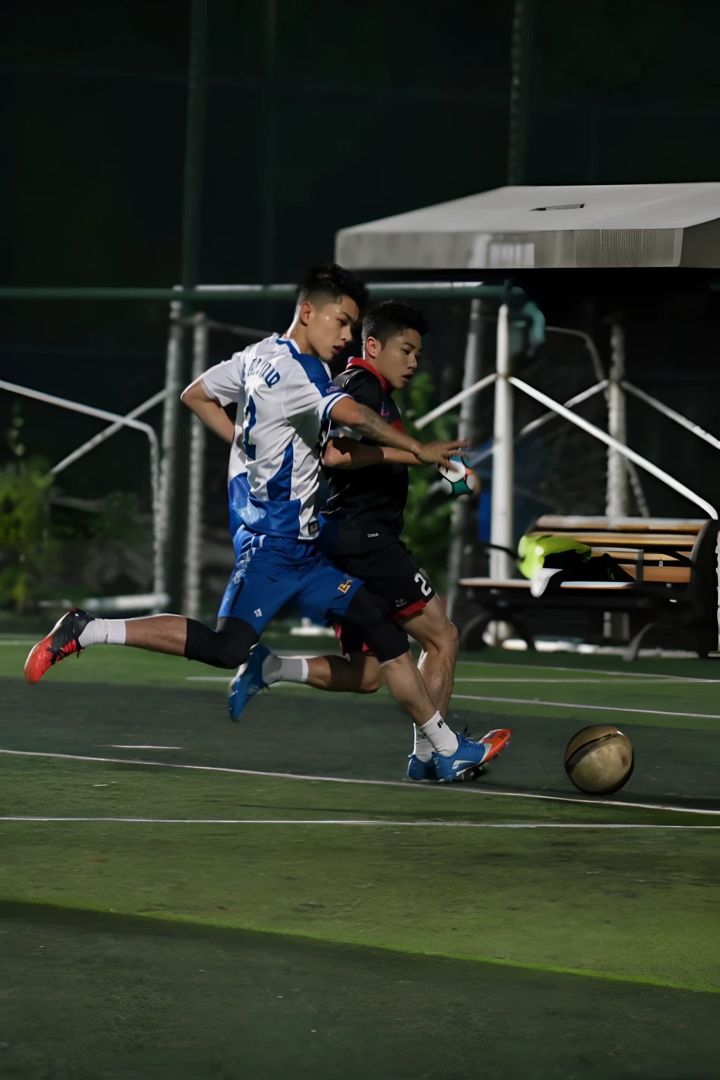 There are two men playing football on the pitch at night, taken with canon 8 0 d, dribbble, play soccer, action shot, taken with canon eos 5 d, Shot on Canon EOS R 6, taken with a canon eos 5d, taken with a canon eos 5 d, taken with canon eos 5 d mark iv, on a football field