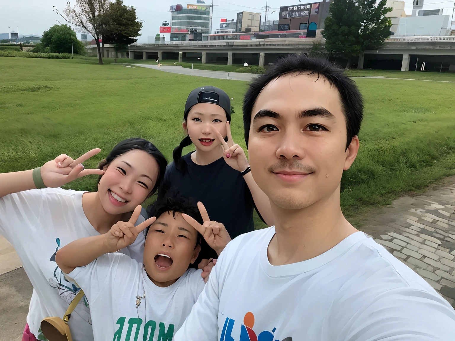 There are three people posing for a photo in the park, Parking in the background, 8k selfie photograph, There is a park in the background, iPhone Capture, vacation photo, Happy family, A family standing in a park, Photo 8k, Have fun, Aomori, Japan, iPhone Photos, in tokio, Shooting on iPhone 14 Pro