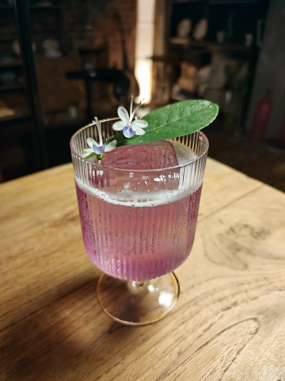 There is a glass of pink liquid,There is a flower on it, cocktail in an engraved glass, drink, violet polsangi, drinking cocktail, Sour, Masterpiece works of art, Inspired by Wlodzimierz Tetmajer, author:Emma Andievska, drinking a drink, Self-restraint, author:Alice Mason