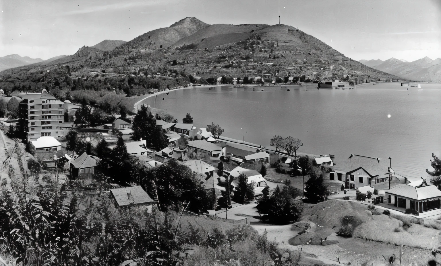 arafed view of a town with a mountain in the background, 1 9 4 0 picture, 1 9 4 0 setting, 1 9 3 8 photo, 1940s photo, 1 9 4 8 photo, 1930 photo, historic photo, archival photo, taken in the early 1930s