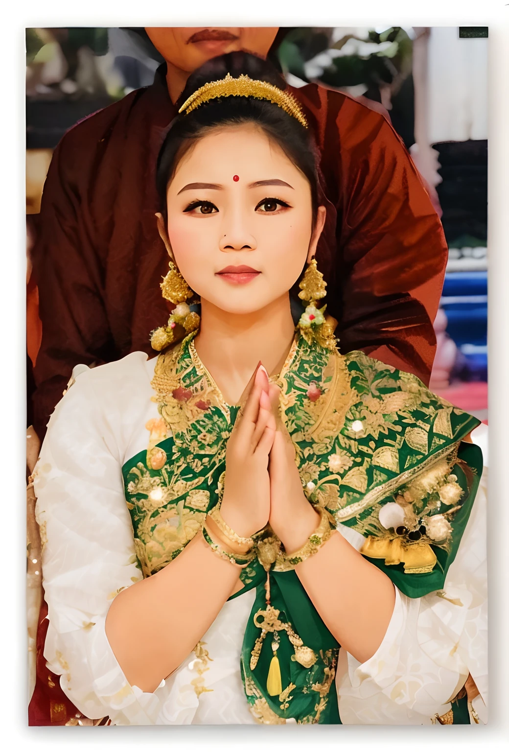 Thai woman in a green and gold outfit with a man in a brown jacket, sukhothai costume, traditional beauty, in style of thawan duchanee, wearing traditional garb, wearing authentic attire, laos, traditional dress, traditional tai costume, nivanh chanthara, south east asian with long, serene expression, traditional clothes