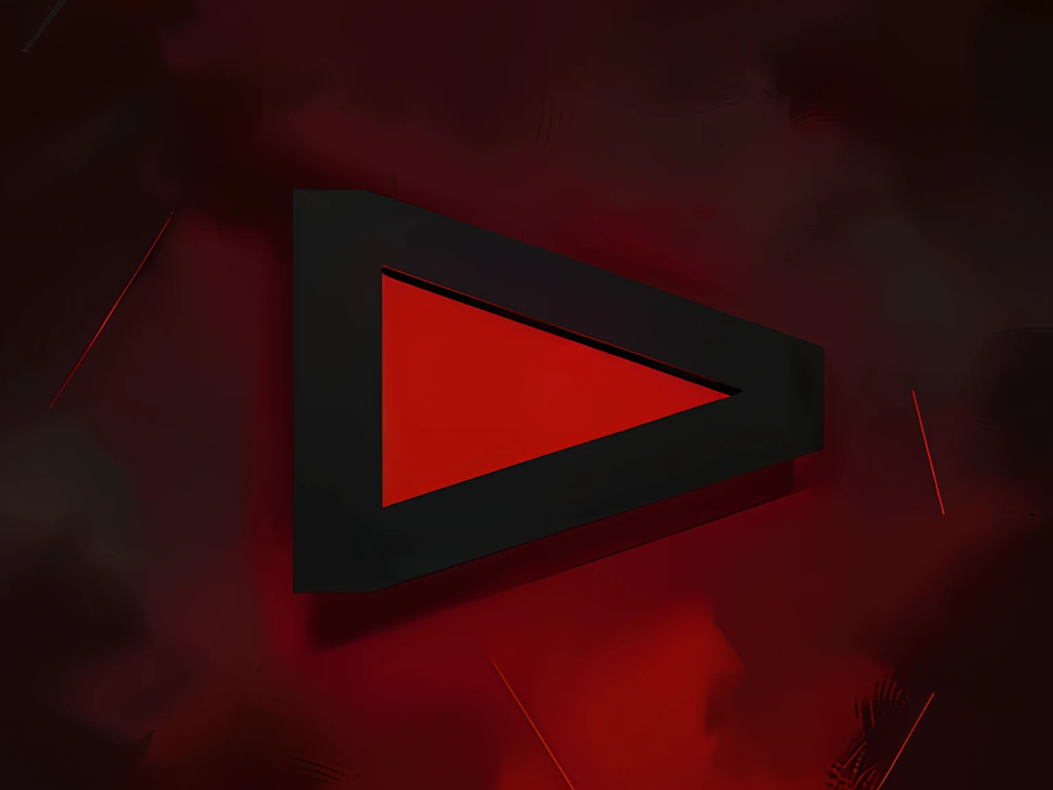 a closeup of a red triangle on a black surface