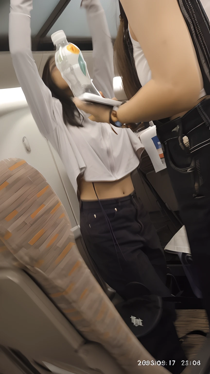 there is a woman holding a remote control in her hand, Her navel was exposed, Physical : tinyest midriff ever, tinyest midriff ever, exposed midriff, belly button showing, beautiful midriff, wearing a crop top, wearing dirty travelling clothes, belly exposed, wearing sexy cropped top, wearing a crop top