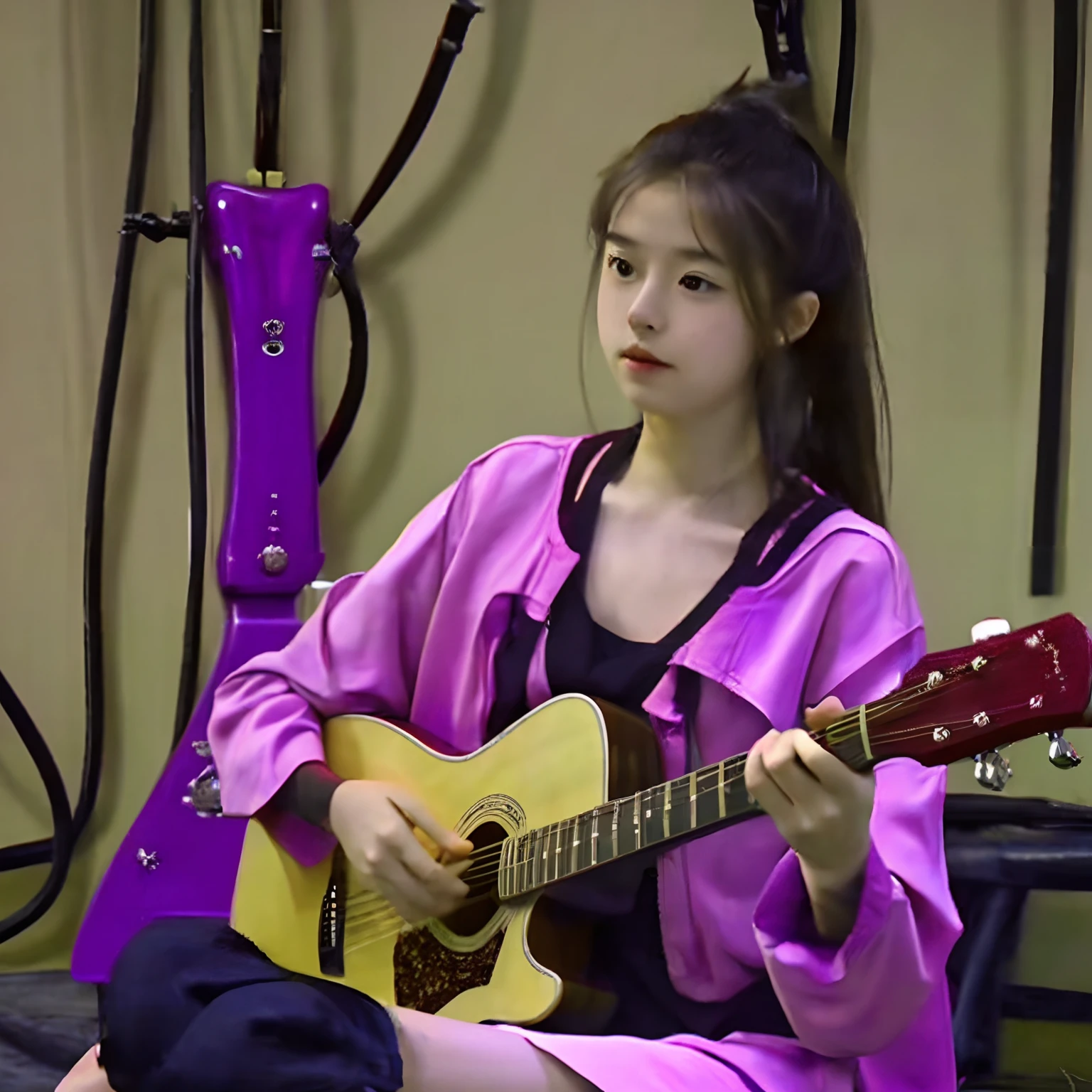 A girl playing guitar