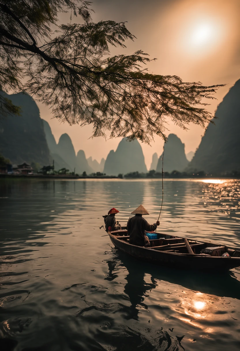 A fisherman on the Li River at sunset fishes on a bamboo raft