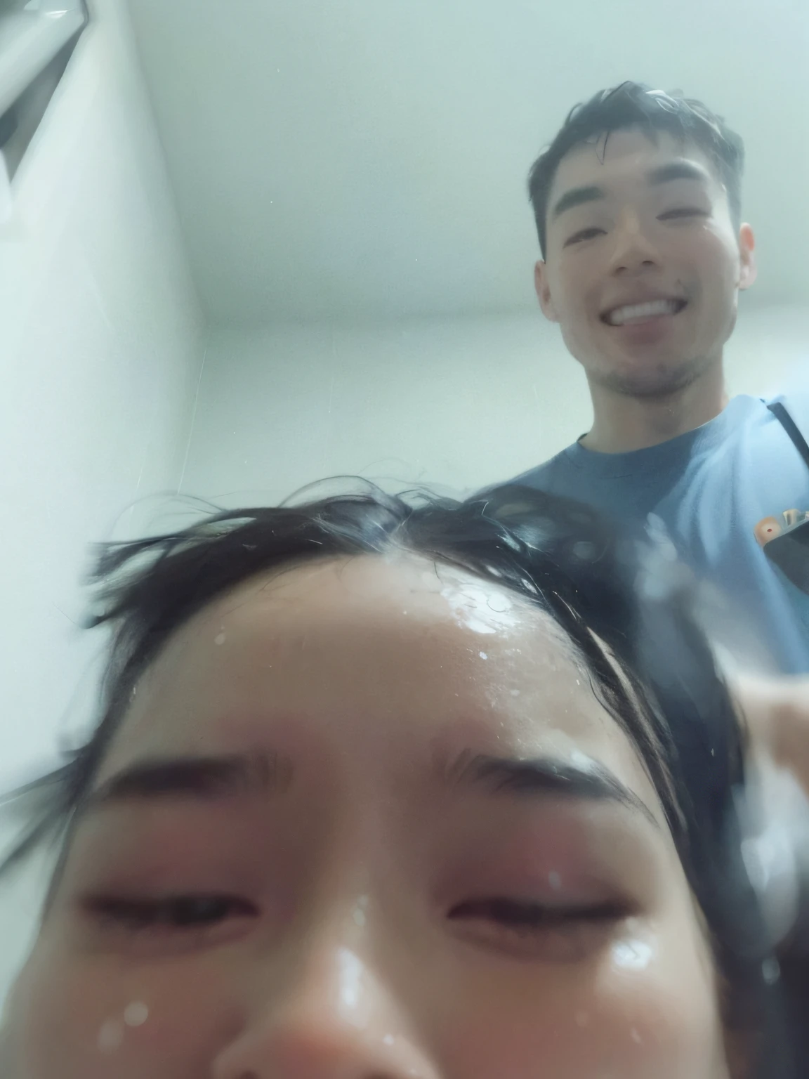 there is a man and a woman taking a selfie together, wet hair, with wet faces!!, selfie shot straight on angle, distorted photo, soaking wet hair, greasy hair, with a big head, selfie photo, selfie!!!!!, iphone selfie, bad selfie, taken on go pro hero8, blurry image, dripping with oil in the head, sweaty face