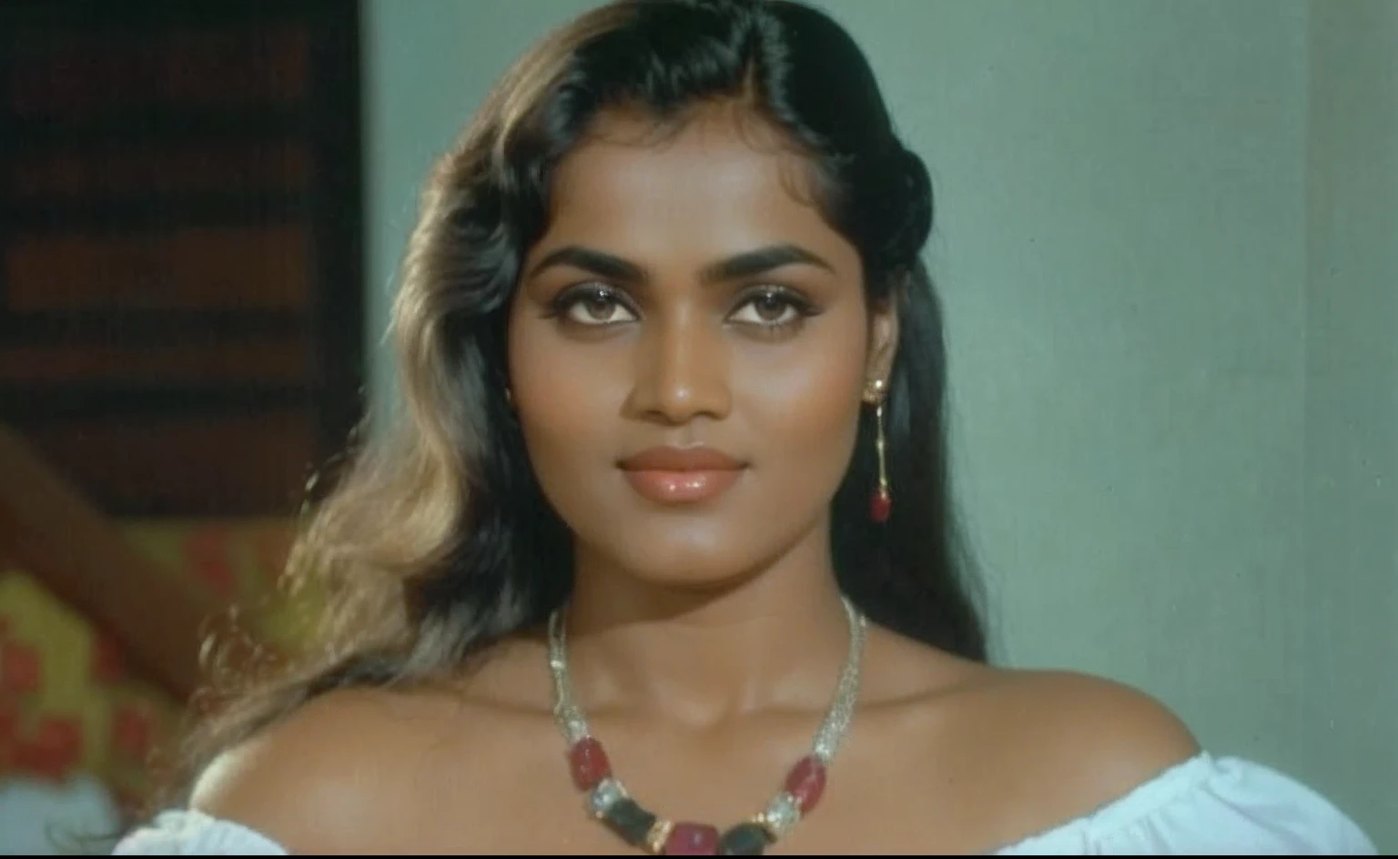 Silk Smitha was a beautiful woman with dark brown hair, shoulder-length and wavy. Her almond-shaped eyes were dark brown and her cheekbones were high. She had full lips, a small nose, and an oval face. Her skin was light and she often wore a confident and sultry expression