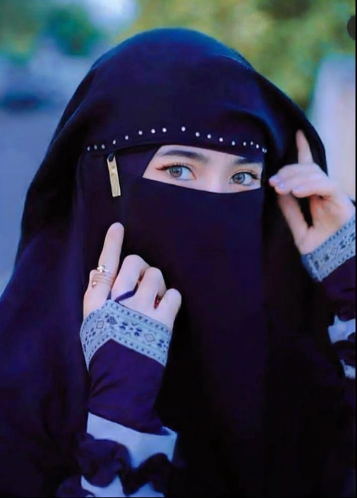 a women in a niqab, <lora:unobjectified_women_v2.1:0.8>,