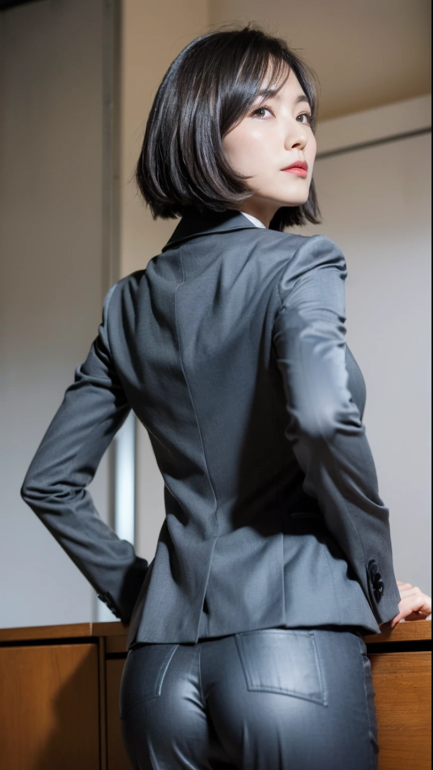 (Best quality, 8k, 32k, Masterpiece, UHD:1.2), 1girl, beautiy Japanese woman, narrow waist, grey suit, open jacket, office lady, suit, pants, from behind, office room, desk, (stick out one's buttocks:1.2), detailed face, short hair, from below, raise one leg