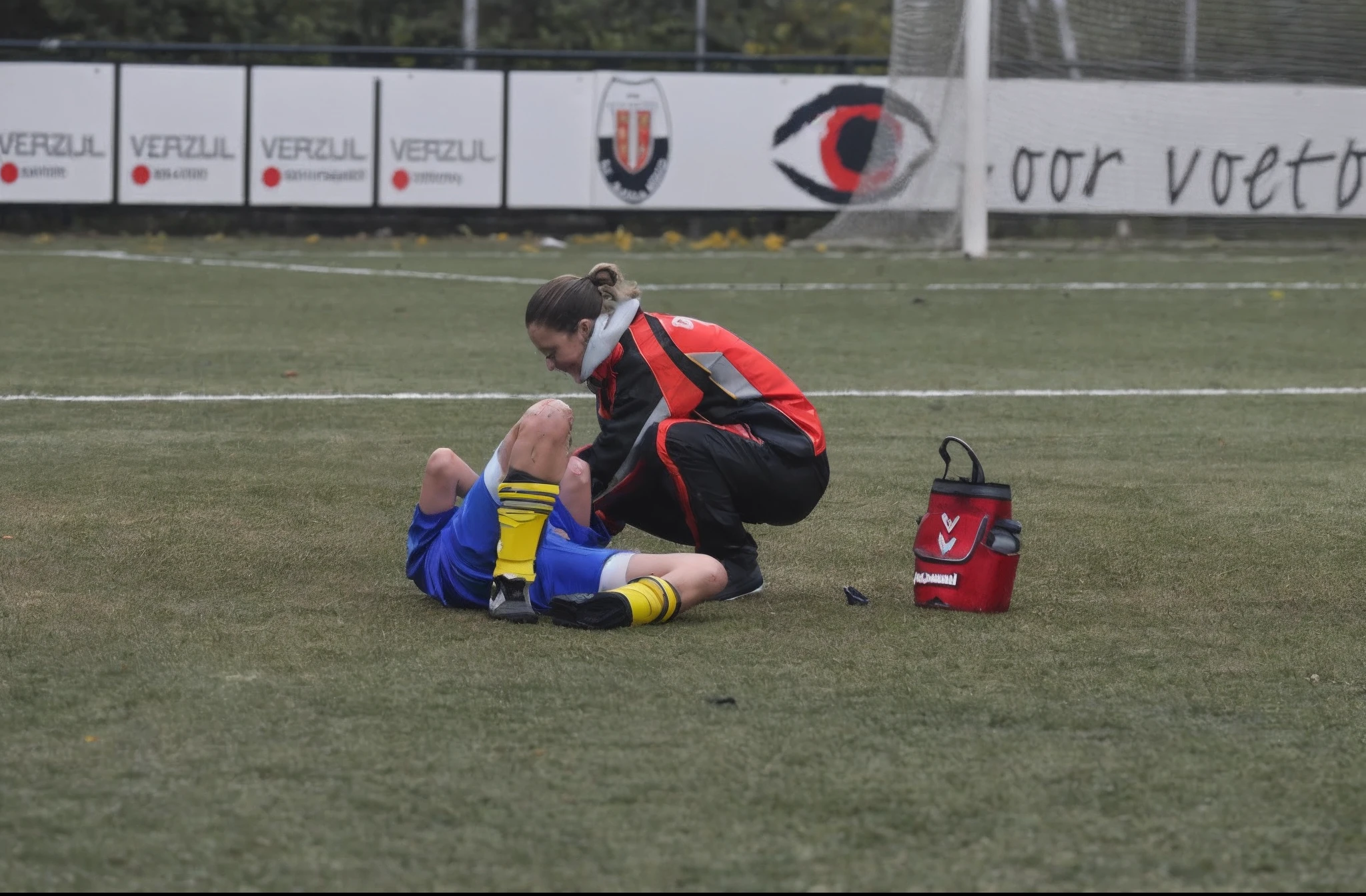 a woman in high-gloss fullbody rainsuit made from plastic, a woman in a shiny plastic-catsuit is giving treatment to an injured soccer player, (8k, RAW photo, best quality, masterpiece:1.2), (realistic, photo-realistic:1.4), (ultra_highres), (ultra-detailed),
1girl, beautiful face, taiwanese, blonde hair, top knot,long hair, ((hairpin)), slick back,
((cyborg, android)), cyberpunk, ((indigo porcelain cover)), electric wire, robotics, (exoskeletons, mechanical upgrades, bionic limbs:1.2), prosthetic technology, ((indigo body parts)), medium breasts, gold rims, platinum rims, mechanical, shimmering led,
japanese family coat, sleeveless, indigo, short socks, Kamon,
standing, robotic arms around knees,
metal steel building, street,