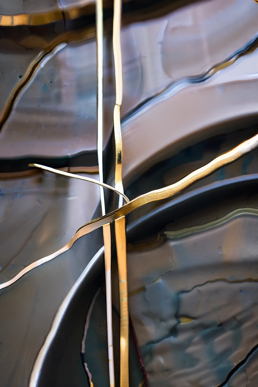 "Random and irregular kintsugi patterns adorning cracked ceramic art, capturing the essence of serendipity. Delicate metallic lines mend fractures haphazardly, creating an unplanned yet captivating design. The interplay of gold and silver infuses the scars with an unexpected charm, forming an unstructured motif. This image embodies the spontaneous beauty of accidentally broken Japanese pottery, celebrating the art of kintsugi."