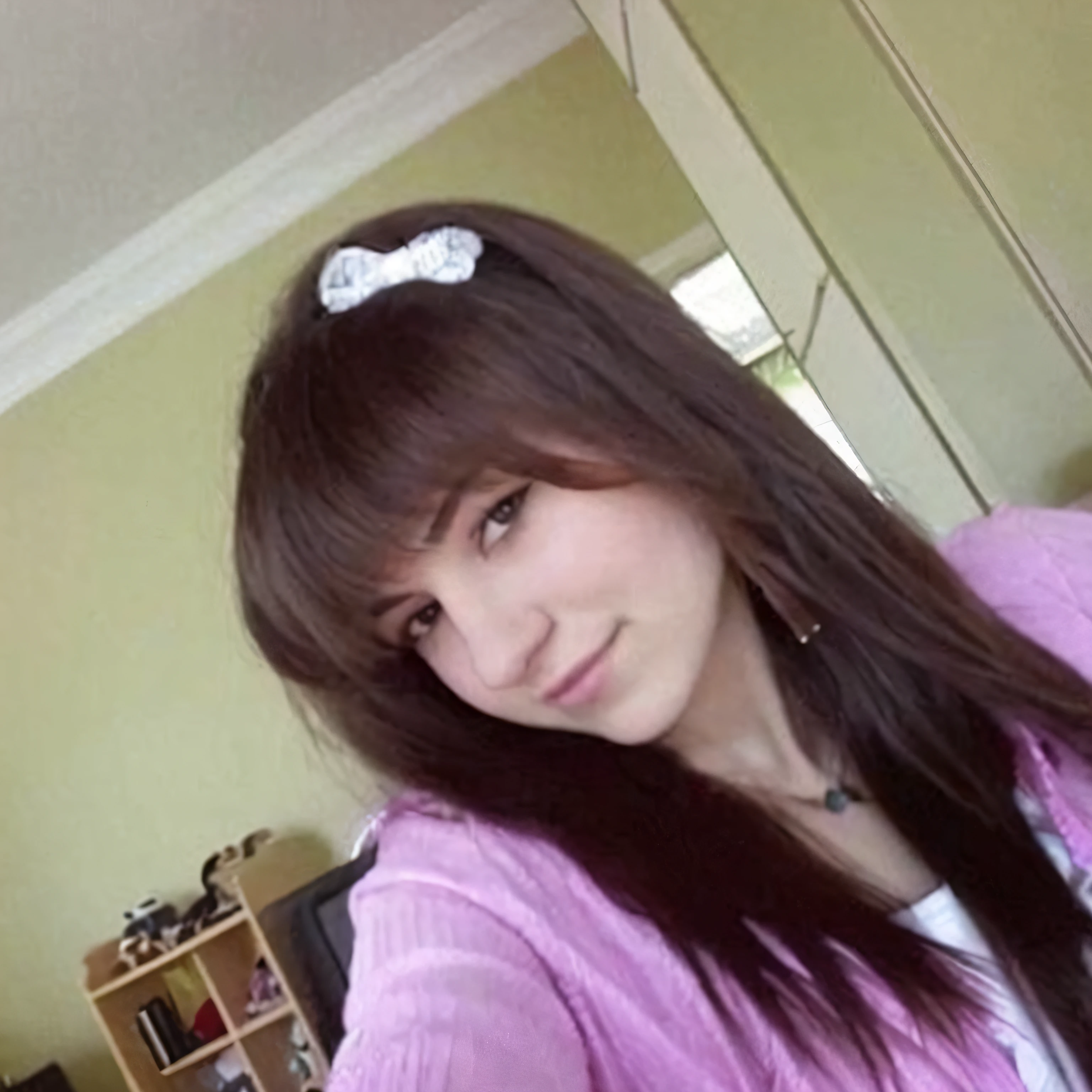 arafed woman taking a selfie in a living room with a cat, brown long hair with bangs, brown hair and bangs, girl with dark brown hair, brown hair with bangs, long hair with bangs, long dark hair with bangs, profile photo, long hair with full bangs, 18 years old, kaitlyn michelle siragusa, with long hair and piercing eyes
