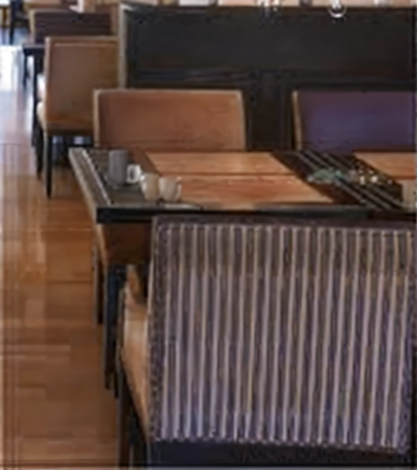 There was a long table and a bunch of chairs in the room, coffee table, tables and chairs, chairs and tables, restaurant, floor grills, Bar, gauges, hundreds of chairs and tables, wood furnishings, sitting on a mocha-colored table, Fine portrait, lounge furniture, Elegant atmosphere, Connect tables and walls, empty stools, wooden tables