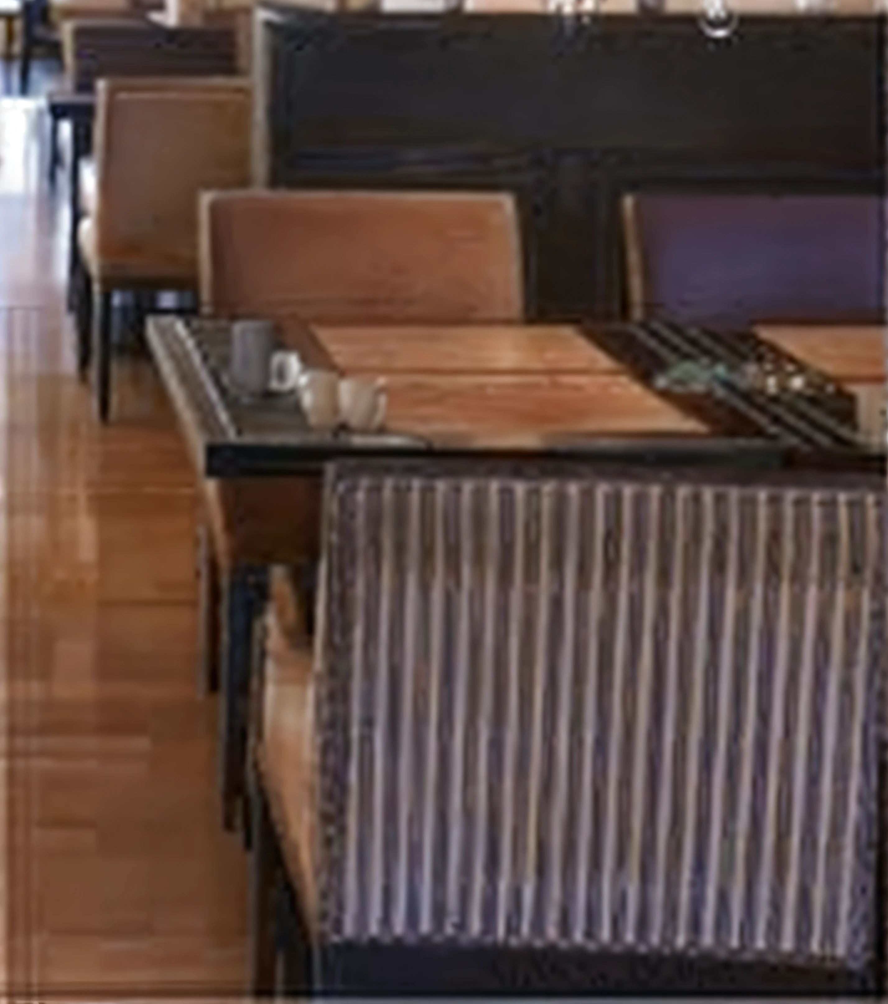 There was a long table and a bunch of chairs in the room, coffee table, tables and chairs, chairs and tables, restaurant, floor grills, Bar, gauges, hundreds of chairs and tables, wood furnishings, sitting on a mocha-colored table, Fine portrait, lounge furniture, Elegant atmosphere, Connect tables and walls, empty stools, wooden tables
