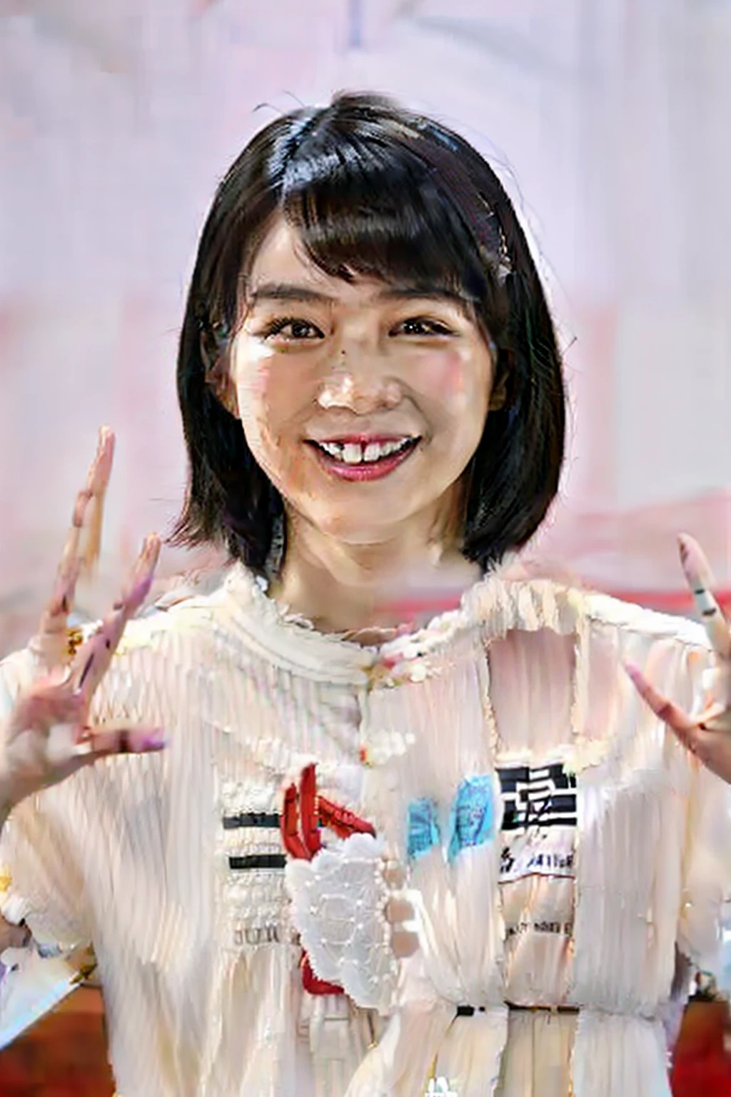 Smiling and wearing white clothes for peace sign