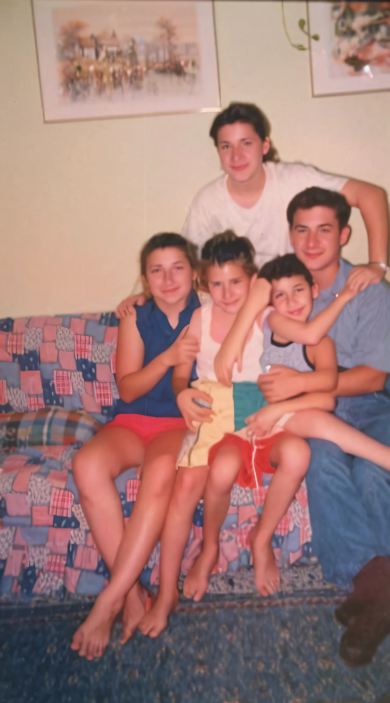 there are a group of people sitting on a couch together, taken in the mid 2000s, taken in 1 9 9 7, scanned, taken in the early 1990s, 90's color photo, taken in the late 2000s, around 1 9 years old, scanned 2400 dpi