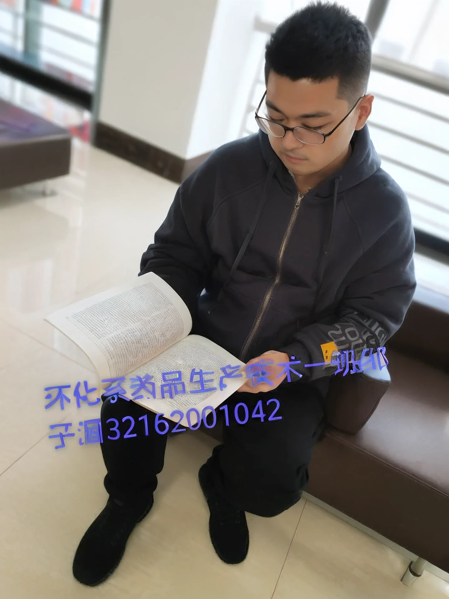 Arafard man sitting on couch reading a book, research, Student, Li Zixin, reading new book